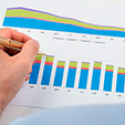 businessperson-analyzing-graphs-close-up-of-businessperson-analyzing-colorful-graphs-on-paper-stock-photography_csp29856602
